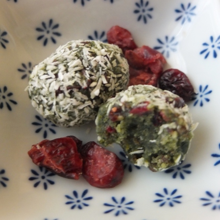 Spirulina date and cranberry bliss balls with matcha, ginger and orange zest