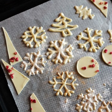 White chocolate piped snowflake decorations